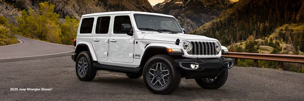 Front 3/4 shot of the Jeep Wrangler parked overlooking mountains