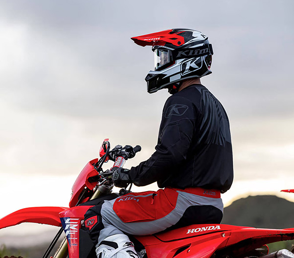 Person sitting on Honda dirtbike