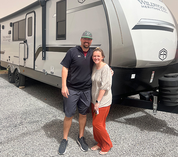 Couple in front of an RV