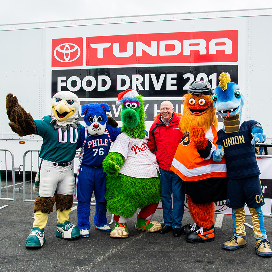 Community involvement, posing with mascots